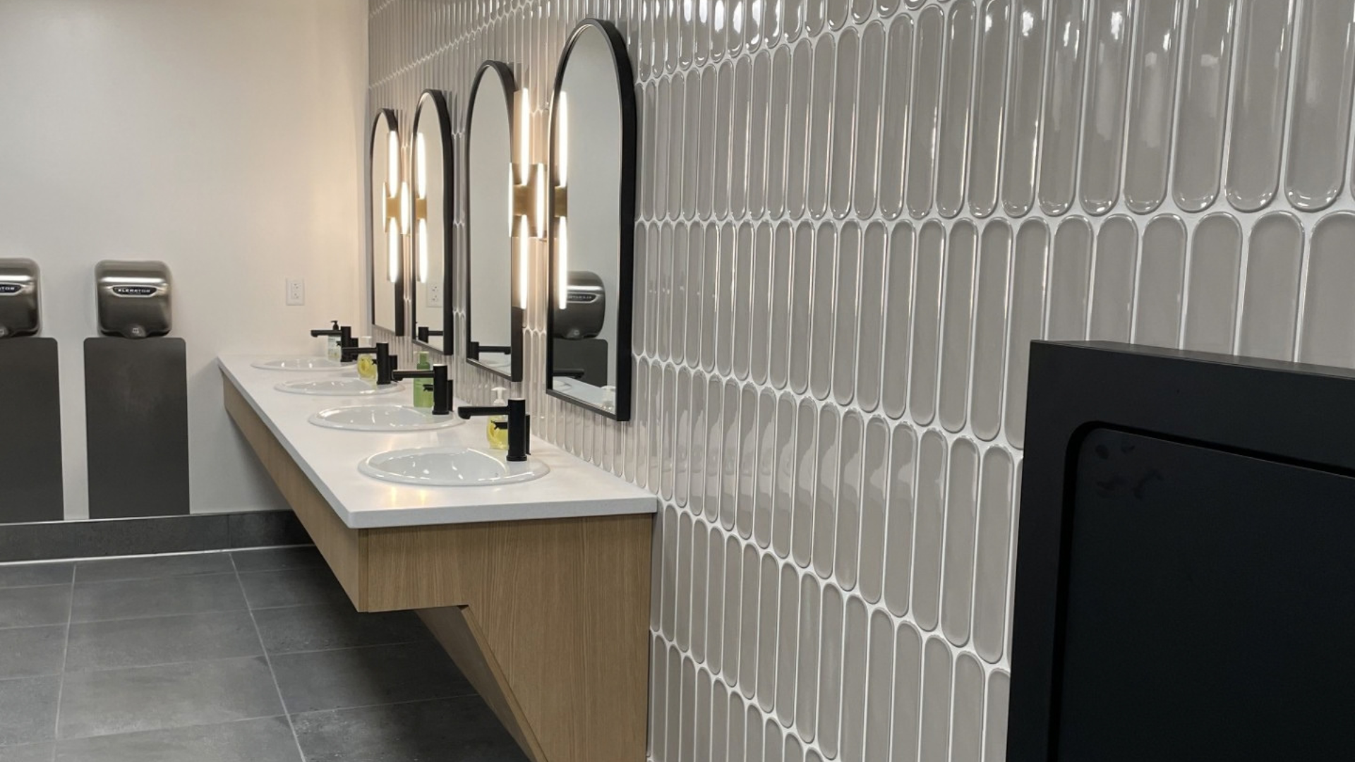tile flooring and tile backsplash in commercial bathroom installation in Wooster, OH